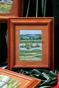 Load image into Gallery viewer, custom framed wood panel original painting by meredith raiford akins of an island in the middle of a river with the blue ridge mountains in the background
