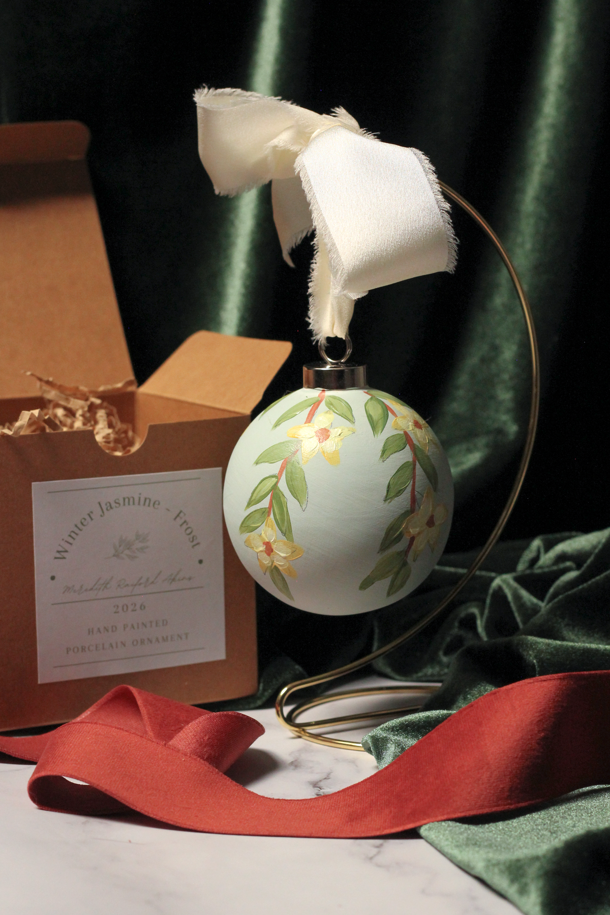 Winter Jasmine hand-painted round Christmas ornament in Frost, a pale icy green