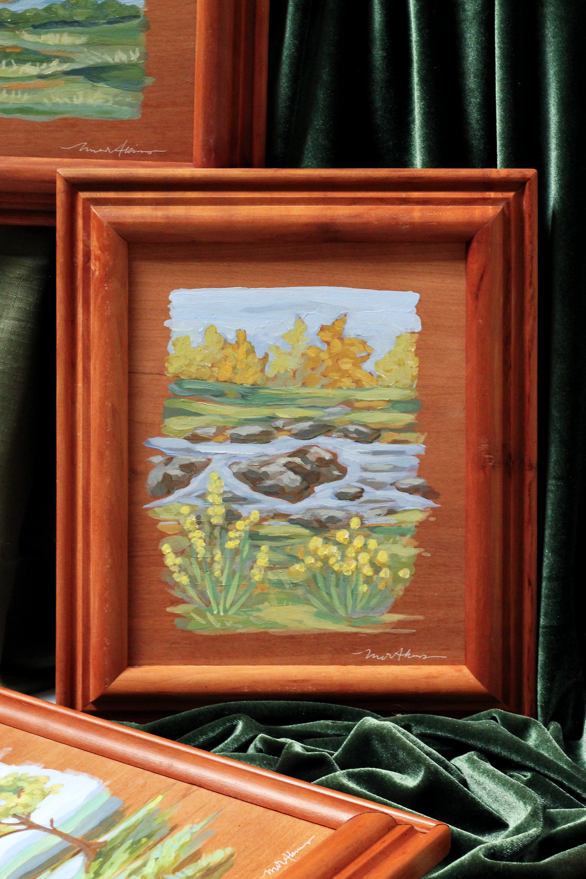 custom framed original acrylic mountain landscape painting by meredith raiford akins featuring a rocky creek with yellow flowers and fall foliage. Painterly, raw edged and unique