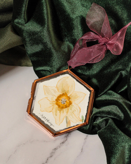 handpainted daffodil ornament in glass frame by meredith raiford akins